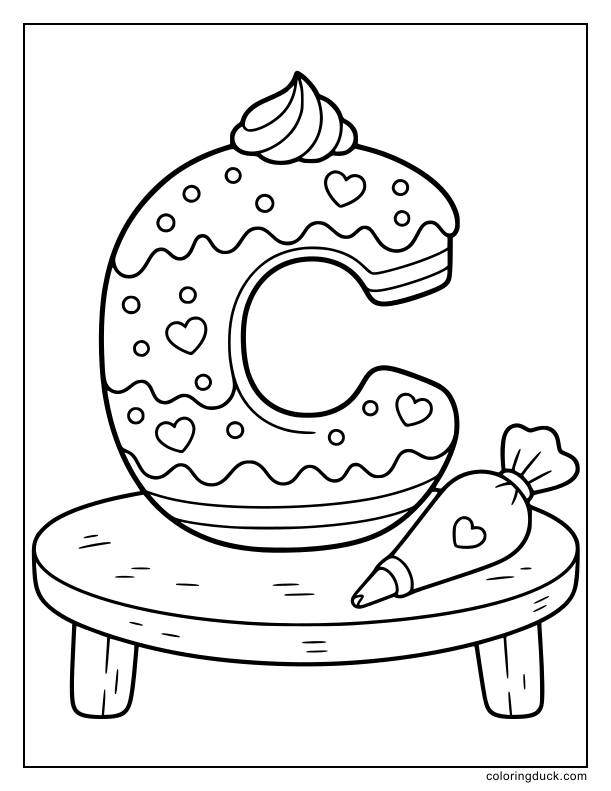 Deliciously frosted cake shaped like the letter C sitting on a simple table.